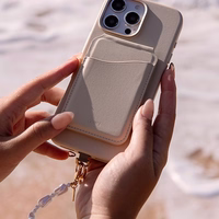 UNIQ Coehl Perla Handstrap universalus telefono rankinis dirželis baltas/baltas pearl