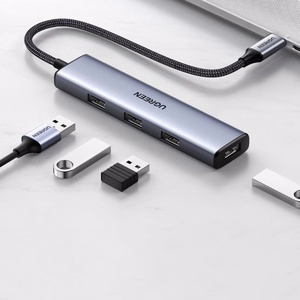 Adapteris Ugreen 2-in-1 sidabrinis (įvestis: Type-C / išvestis: 4-USB)