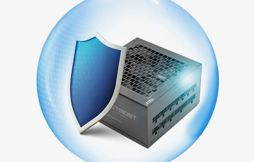 Juodas kompiuterio maitinimo blokas su disku mėlyname burbule pilkame fone